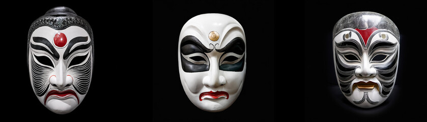 Naklejka premium Three isolated, ornate masks against a black background.