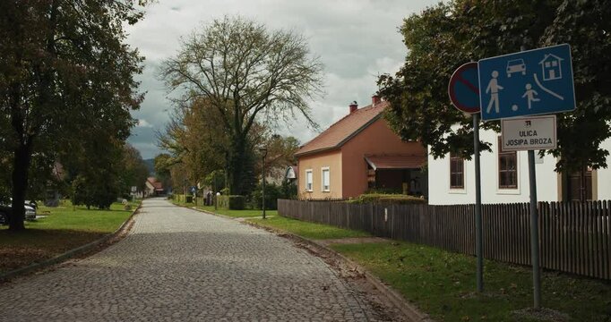 Quiet cobblestone street in Kumrovec village on Josip Broz Street, Croatia
