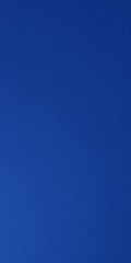 Naklejka premium Dark blue artificial leather surface with a smooth texture, set against a matching dark blue background, material