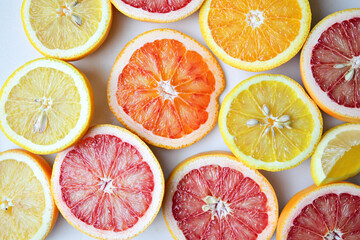 Fototapeta premium flat lay composition of citrus fruits, showcasing vibrant slices of oranges, grapefruits, and lemons