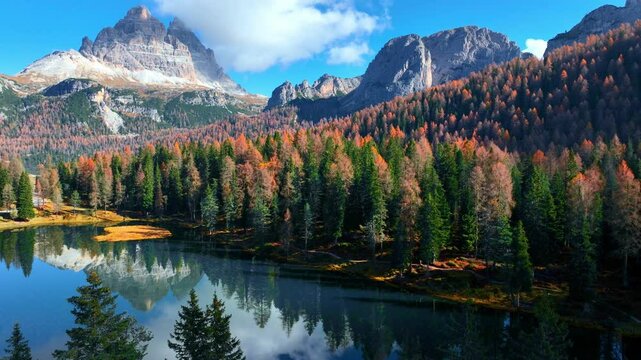 Lake Antorno in autumn in the Dolomites in Italy, aerial view of beautiful lago di Antorno in the Dolomite mountains, drone view of Tre Cime di Lavaredo national park in Italy in the fall