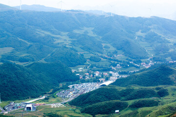 Fototapeta premium A Green Mountain with A Road Going Through lt