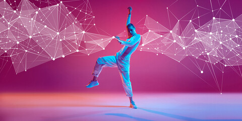 Creative design. Young woman in casual clothes in motion, dynamically dancing hip hop on pink...