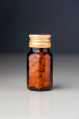 bottle with vitamin pills, close-up view