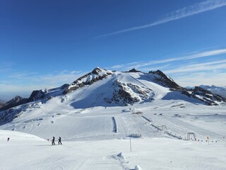 Ski resort in the mountains. Sunny day on Hintertuxer Glacier in Austrian Alps.