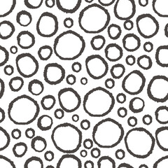 Dark brown circles seamless patten. Hand drawn rings on white background. Abstract circle background.