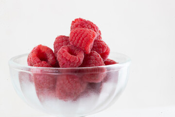 Close-up of raspberry fruit, one and several.