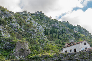 Walls of the Kotor Fortress with mountains and blue sky, Montenegro