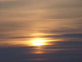 Fototapeta premium Cloudy sky, sunrise light and orange yellow clouds - natural background. Topics: weather, meteorology, atmosphere, sky space, winter, morning