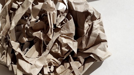 Crumpled beige paper, cardboard. Paper texture. Paper background.