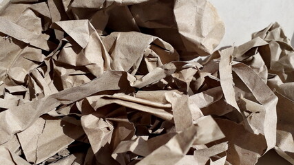 Crumpled beige paper, cardboard. Paper texture. Paper background.
