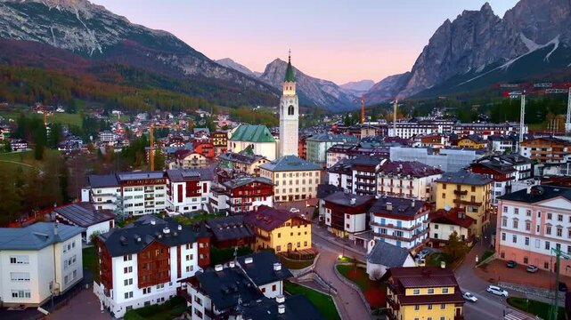 Aerial view of Cortina d Ampezzo in the Dolomites in Italy at sunrise, beautiful famous Italian alpine village of Cortina, Winter Olympics site, travel in the Dolomites
