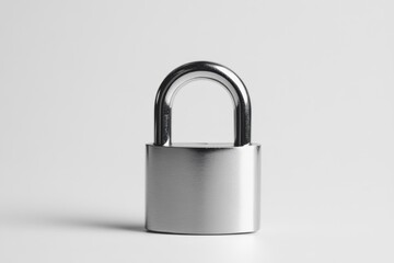 A Silver Lock With No Keyhole Sitting on Plain White Surface.