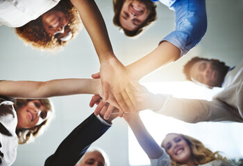 Partnership, hands together and business people from below in office with unity, team building and...