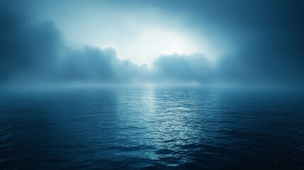 A calm, blue ocean with a cloudy sky in the background