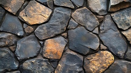 Obraz premium A close-up photograph of a textured stone wall.