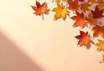 Fototapeta premium Autumn leaves in vibrant orange and yellow hues scattered on light background create warm, inviting atmosphere. Perfect for seasonal themes and nature inspired designs