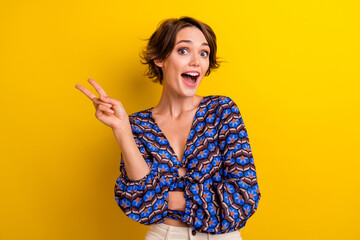 Portrait of young funky girl wear vintage top makes v sign at summer vacation greetings symbol...