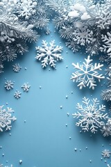 Snowflakes falling on blue background, winter wonderland scene.