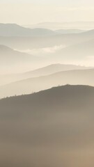 Obraz premium Early morning mist hovers between rolling ridges in a serene landscape, nature