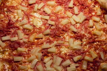 Top view over a delicious swedish pineapple pizza named 