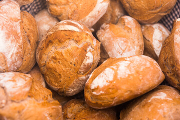 Ruddy rolls of fresh warm grain bread