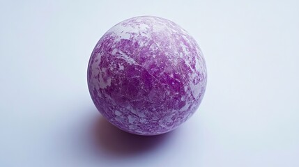 A purple and white marble ball on a white surface