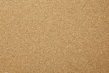 Fine golden sand texture with a smooth, uniform surface, ideal for backgrounds or artistic projects.