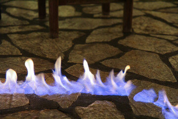 Close-Up of Fire Burning on a Restaurant Floor: Warm Flames and Flickering Light