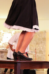 Greek Performer in Traditional Clothes Dancing on a Table: Entertainment at a Restaurant for Guests