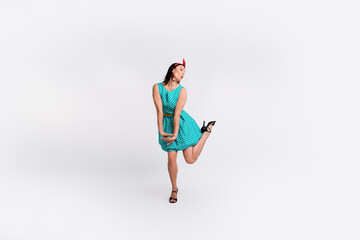 Full size photo of pretty girl dancing energetic enjoy disco wear teal retro style polka dot skirt isolated on white color background