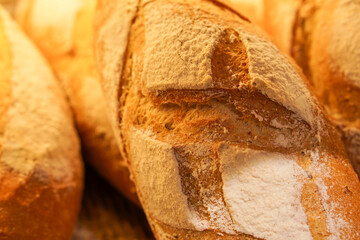 Close-up of traditional French bread and country loaves in a bakery.