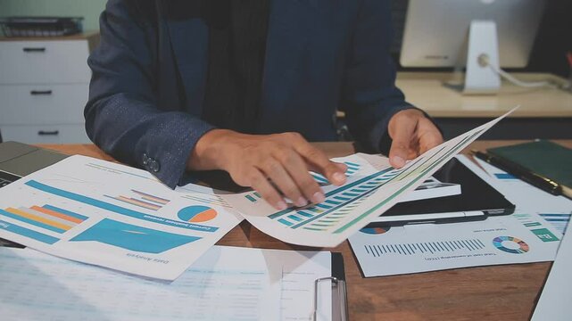 Accounting company provide finance and taxation planning for profitable cash flow, Auditor and accountant team working in office, analyze financial data and accounting record with calculator.Insight
