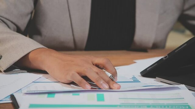 Accounting company provide finance and taxation planning for profitable cash flow, Auditor and accountant team working in office, analyze financial data and accounting record with calculator.Insight