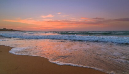 Fototapeta premium Waves on the beach at red sunset