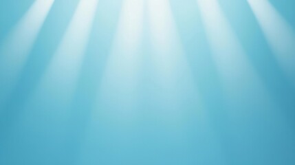Fototapeta premium A serene blue background with soft light rays creating a peaceful and calming atmosphere, perfect for various creative projects and designs.