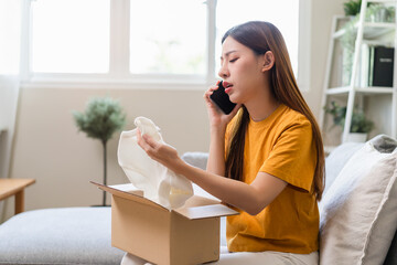 Young woman customer calling to ecommerce client support to complaint about product problem and...