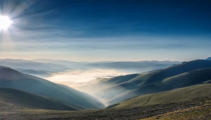 Waves of light in the mountain valley stretch into the sky