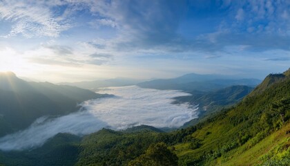 Fototapeta premium Waves of light in the mountain valley stretch into the sky
