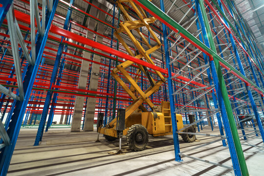 Warehouse Construction with Scissor Lift and Metal Racks