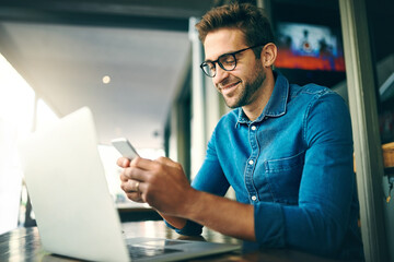 Business man, phone and laptop for networking, research and project management with kpi app in...