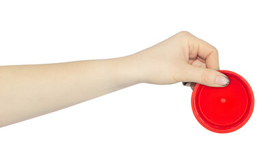 wide cap from a plastic bottle in hand, outstretched hand with cap from a plastic bottle isolated from background	