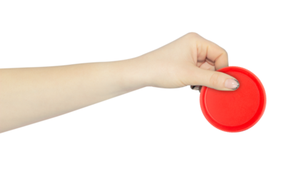 wide cap from a plastic bottle in hand, outstretched hand with cap from a plastic bottle isolated from background	