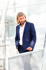 Handsome Young Man in Blue Suit Posing Outdoors