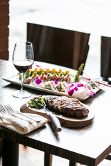Steak and Sushi on table
