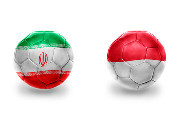 football balls with national flags of indonesia and iran ,soccer teams. on the white background.