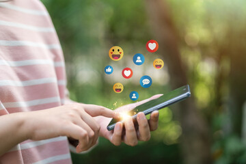 The concept of living on vacation and playing social media. Social media and digital online concept, man using smart phone with Social media. Social Distancing ,Working From Home concept..