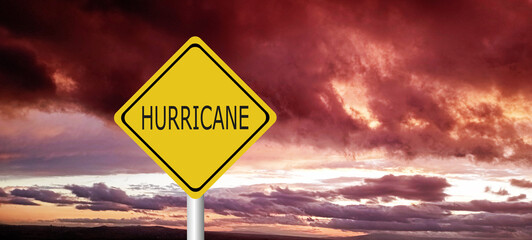 danger,caution,Hurricane Idalia warning sign against a powerful stormy background with copy space. Dirty and angled sign with cyclonic winds add to the drama.hurricane season sign on cloudy background