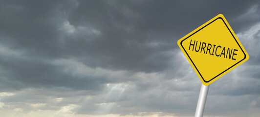 danger,caution,Hurricane Idalia warning sign against a powerful stormy background with copy space. Dirty and angled sign with cyclonic winds add to the drama.hurricane season sign on cloudy background