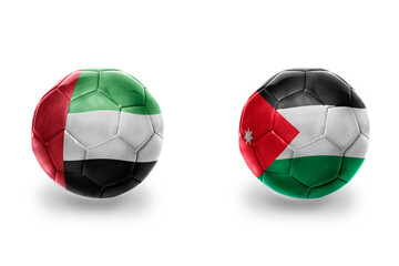 Obraz premium football balls with national flags of jordan and united arab emirates ,soccer teams. on the white background.